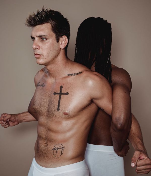 Man performing a controlled strength exercise in a minimalist setting.